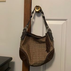 Brown coach shoulder bag, suede bottom, leather handle.